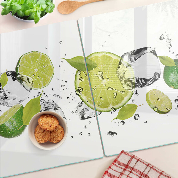 Planche à découper en verre Citrons et glace dans l'eau