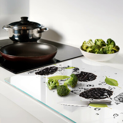 Planche à découper verre Framboises avec des feuilles et des gouttes d'eau
