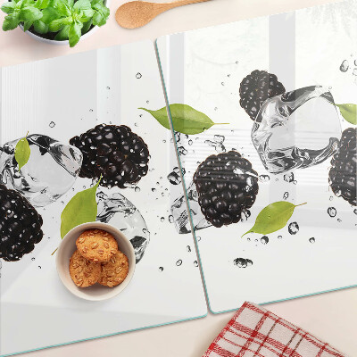 Planche à découper verre Framboises avec des feuilles et des gouttes d'eau
