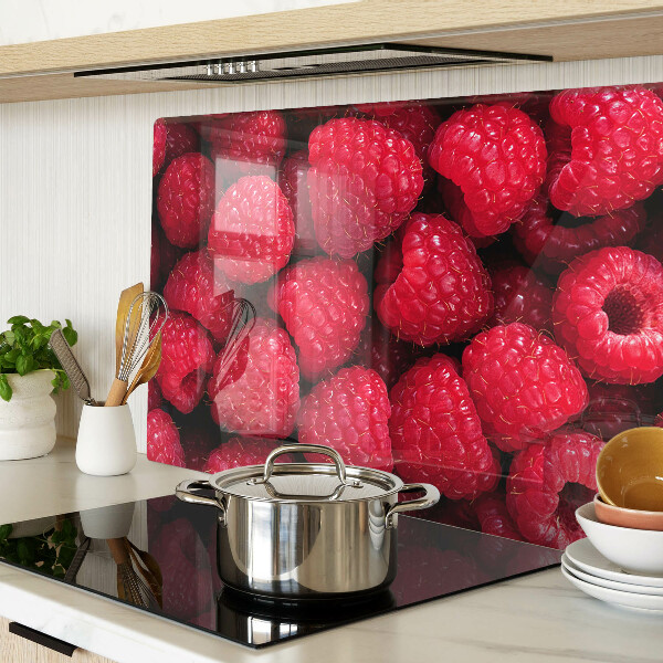 Planche à découper verre Des framboises en arrière-plan