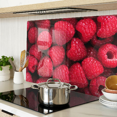 Planche à découper verre Des framboises en arrière-plan