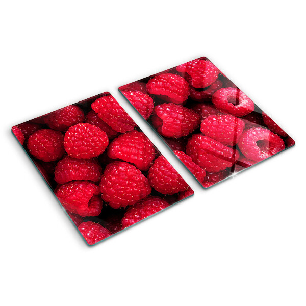 Planche à découper verre Des framboises en arrière-plan
