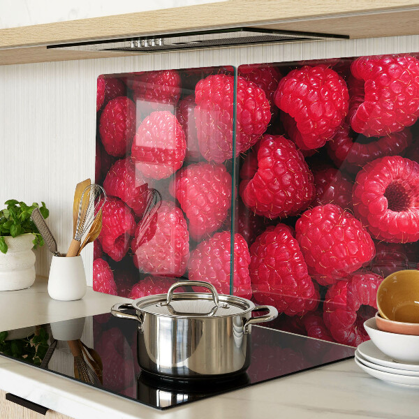 Planche à découper verre Des framboises en arrière-plan