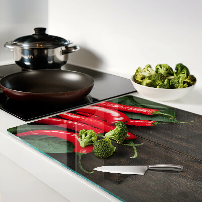 Planche à découper verre Piments sur fond de bois