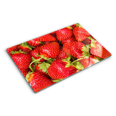 Planche à découper en verre Des fraises en arrière-plan
