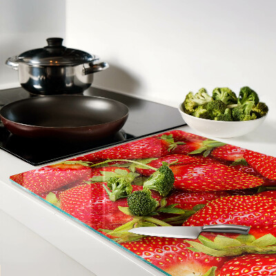 Planche à découper en verre Des fraises en arrière-plan