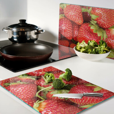 Planche à découper en verre Des fraises en arrière-plan