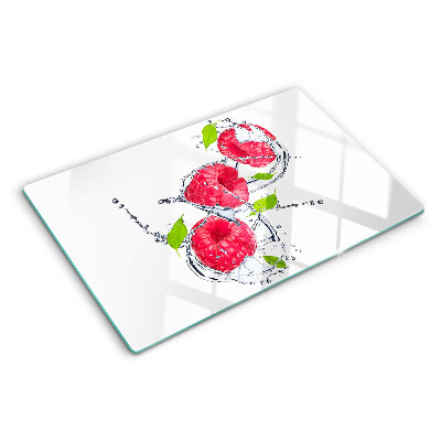 Planche à découper en verre Framboises dans l'eau avec des feuilles