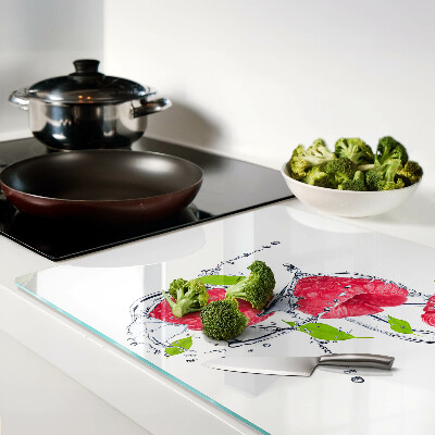 Planche à découper en verre Framboises dans l'eau avec des feuilles