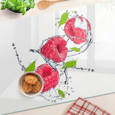 Planche à découper en verre Framboises dans l'eau avec des feuilles