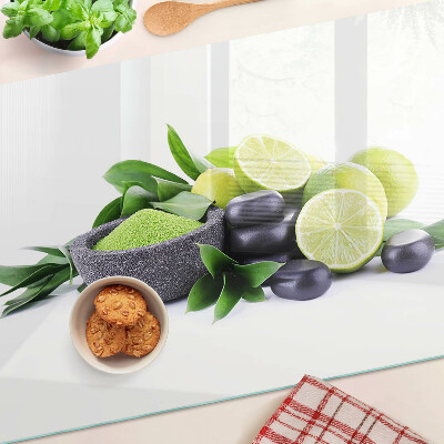 Planche à découper en verre Citrons et raisins sur fond vert