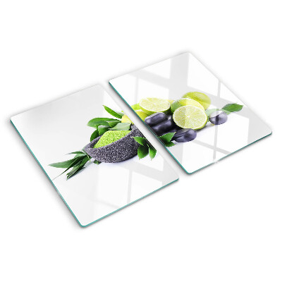 Planche à découper en verre Citrons et raisins sur fond vert
