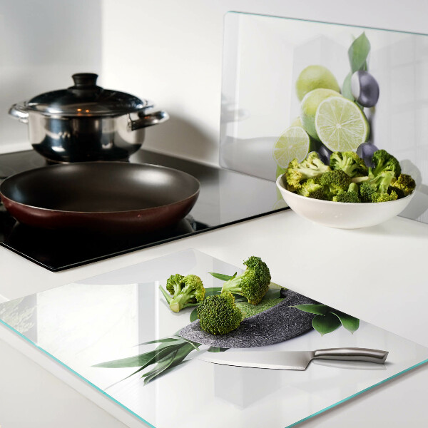 Planche à découper en verre Citrons et raisins sur fond vert