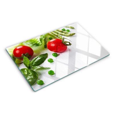 Planche à découper verre Légumes sur un comptoir blanc