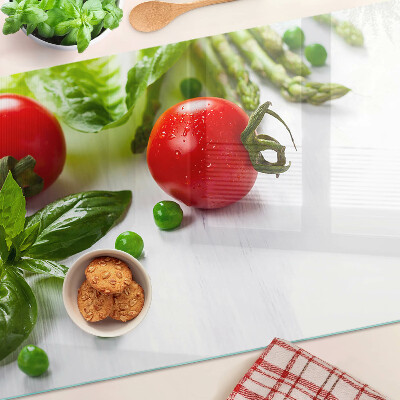 Planche à découper verre Légumes sur un comptoir blanc