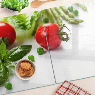 Planche à découper verre Légumes sur un comptoir blanc