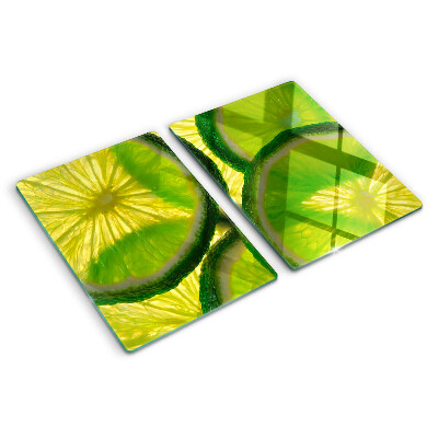 Planche à découper en verre Tranches de citron vert sur fond vert