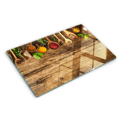 Planche à découper en verre Épices et herbes sur fond de bois