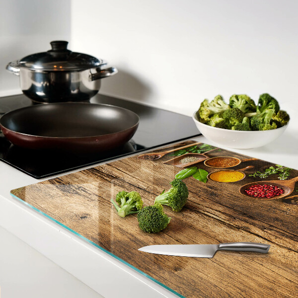 Planche à découper en verre Épices et herbes sur fond de bois