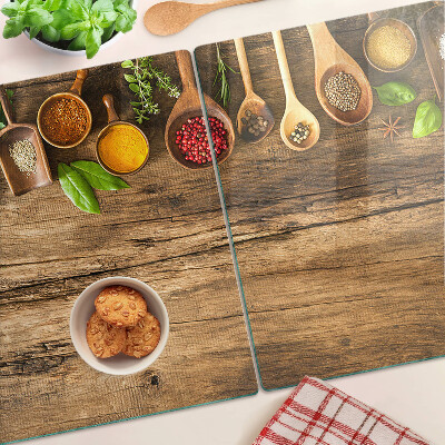 Planche à découper en verre Épices et herbes sur fond de bois