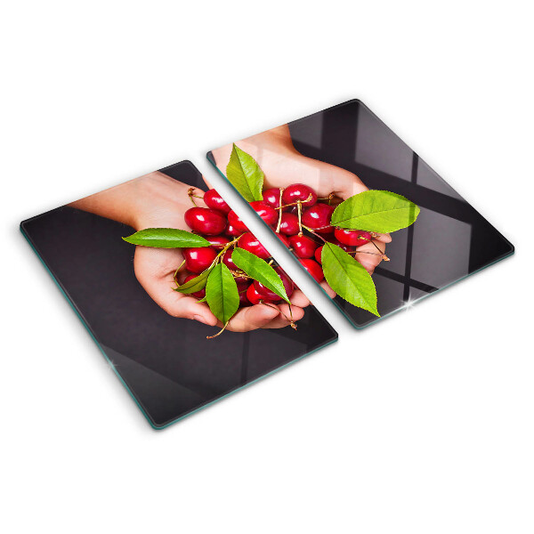 Planche à découper verre Cerises rouges dans les mains