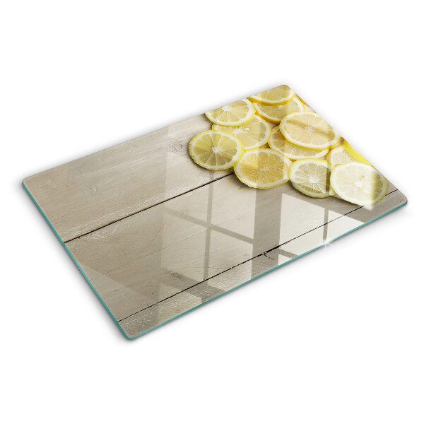 Planche à découper verre Tranches de citron sur fond de bois