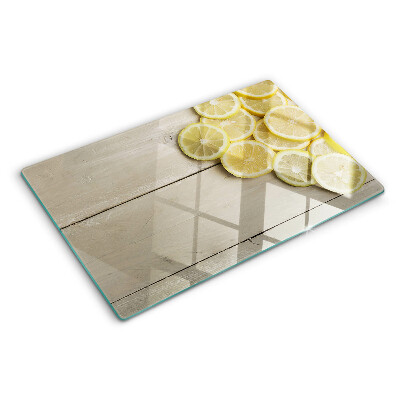 Planche à découper verre Tranches de citron sur fond de bois