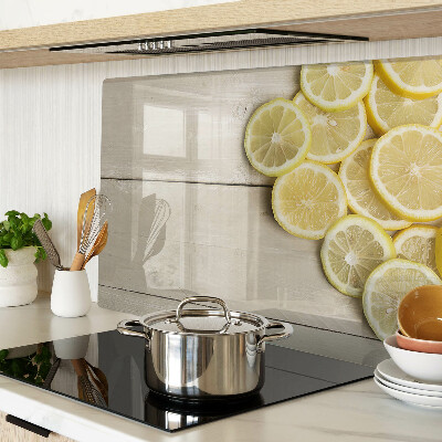 Planche à découper verre Tranches de citron sur fond de bois