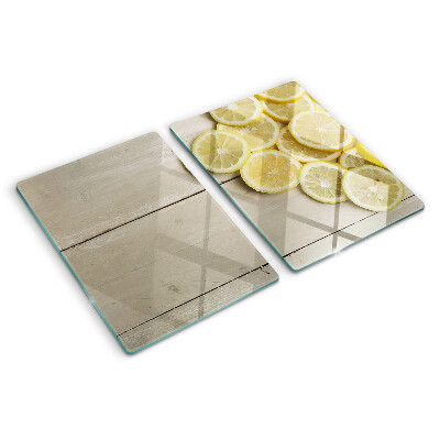 Planche à découper verre Tranches de citron sur fond de bois
