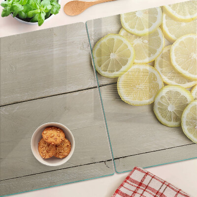 Planche à découper verre Tranches de citron sur fond de bois