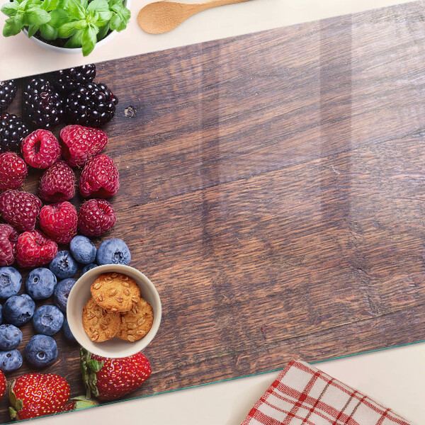 Planche à découper verre Fruits des bois sur fond de bois