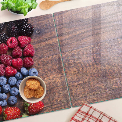 Planche à découper verre Fruits des bois sur fond de bois