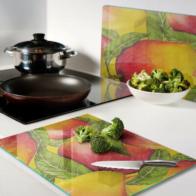 Planche à découper en verre Poivrons sur fond de feuilles vertes