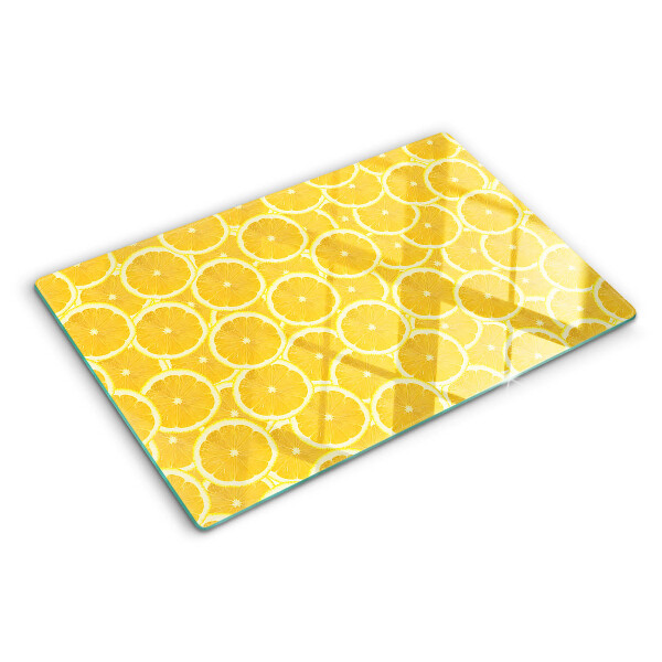 Planche à découper en verre Tranches de citron sur fond jaune