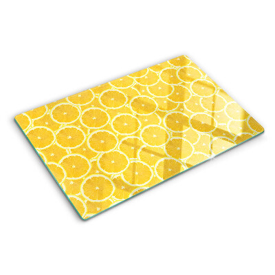 Planche à découper en verre Tranches de citron sur fond jaune