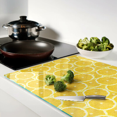 Planche à découper en verre Tranches de citron sur fond jaune