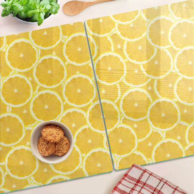 Planche à découper en verre Tranches de citron sur fond jaune