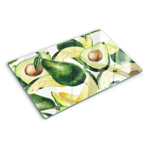 Planche à découper verre Avocat avec des feuilles en arrière-plan