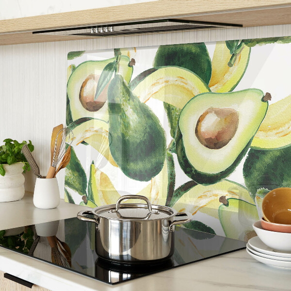 Planche à découper verre Avocat avec des feuilles en arrière-plan