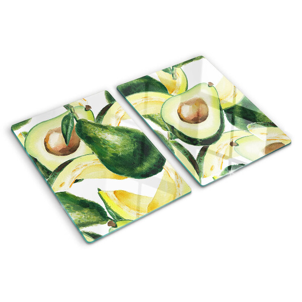 Planche à découper verre Avocat avec des feuilles en arrière-plan