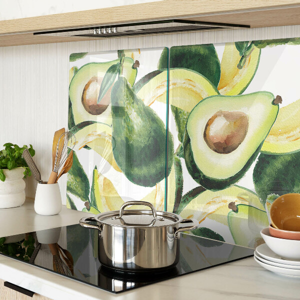 Planche à découper verre Avocat avec des feuilles en arrière-plan