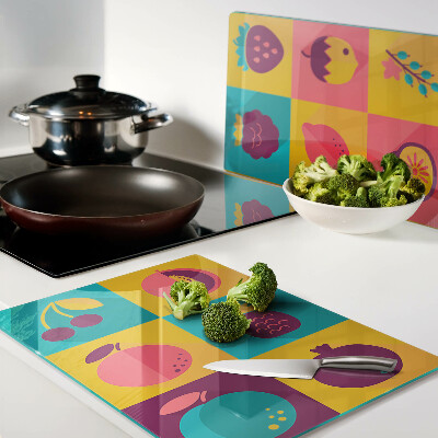 Planche à découper en verre Motif de fruits dans des carrés colorés