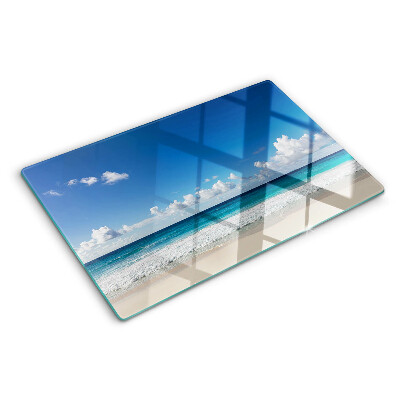 Planche à découper en verre Une plage avec de l'eau turquoise et des nuages