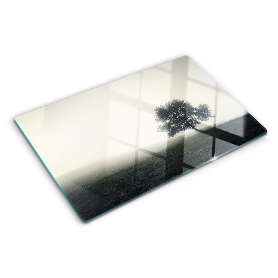 Planche à découper verre Un arbre dans un paysage brumeux