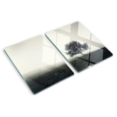 Planche à découper verre Un arbre dans un paysage brumeux