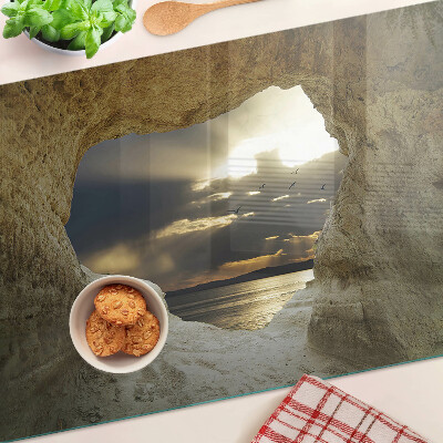 Planche à découper verre Vue sur la mer à travers la grotte