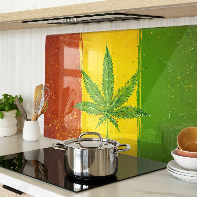 Planche à découper verre Feuille de cannabis sur fond coloré