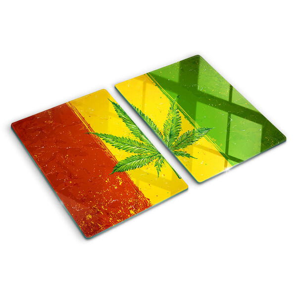 Planche à découper verre Feuille de cannabis sur fond coloré