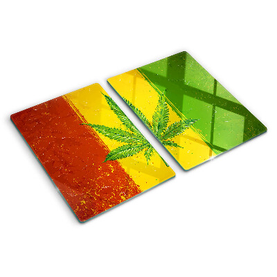 Planche à découper verre Feuille de cannabis sur fond coloré