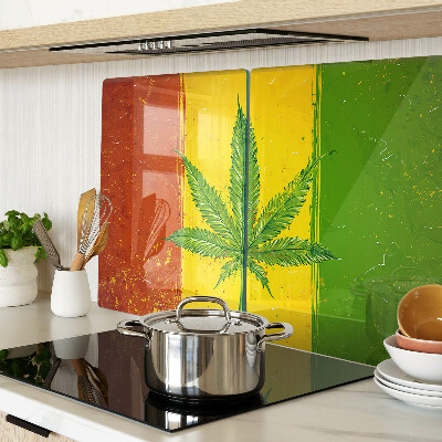 Planche à découper verre Feuille de cannabis sur fond coloré